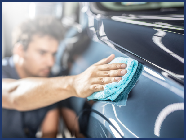 technician detailing a vehicle